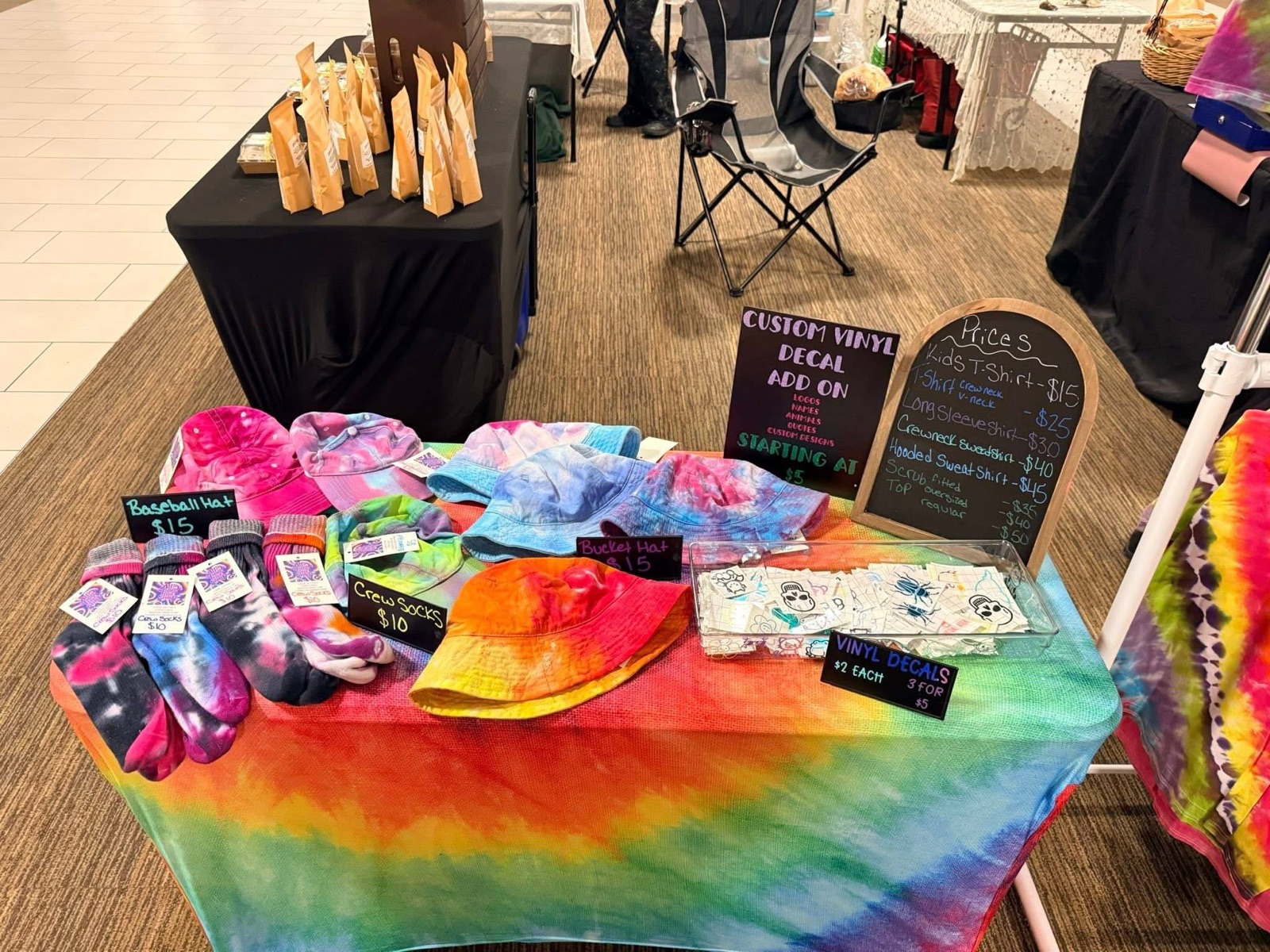AlliPop market table full of rainbow tie-dye
